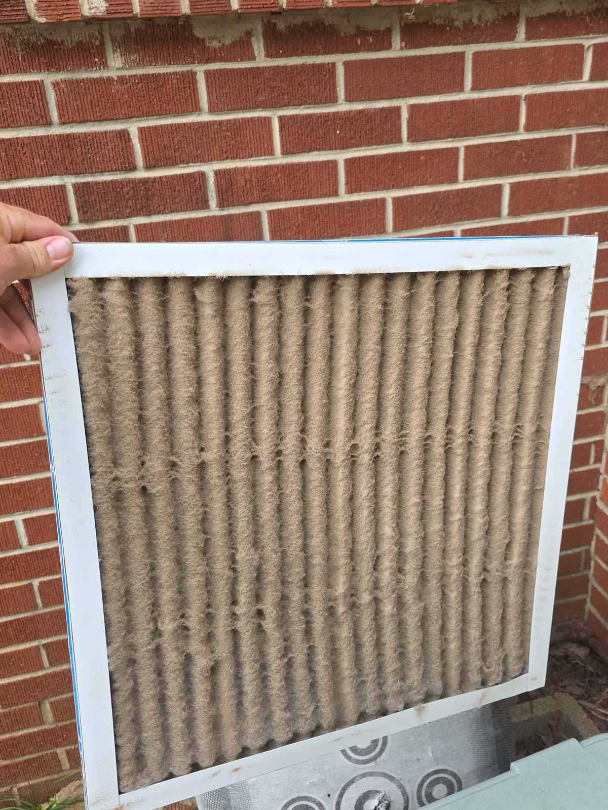 Severely clogged HVAC return filter pulled from a Texas home
