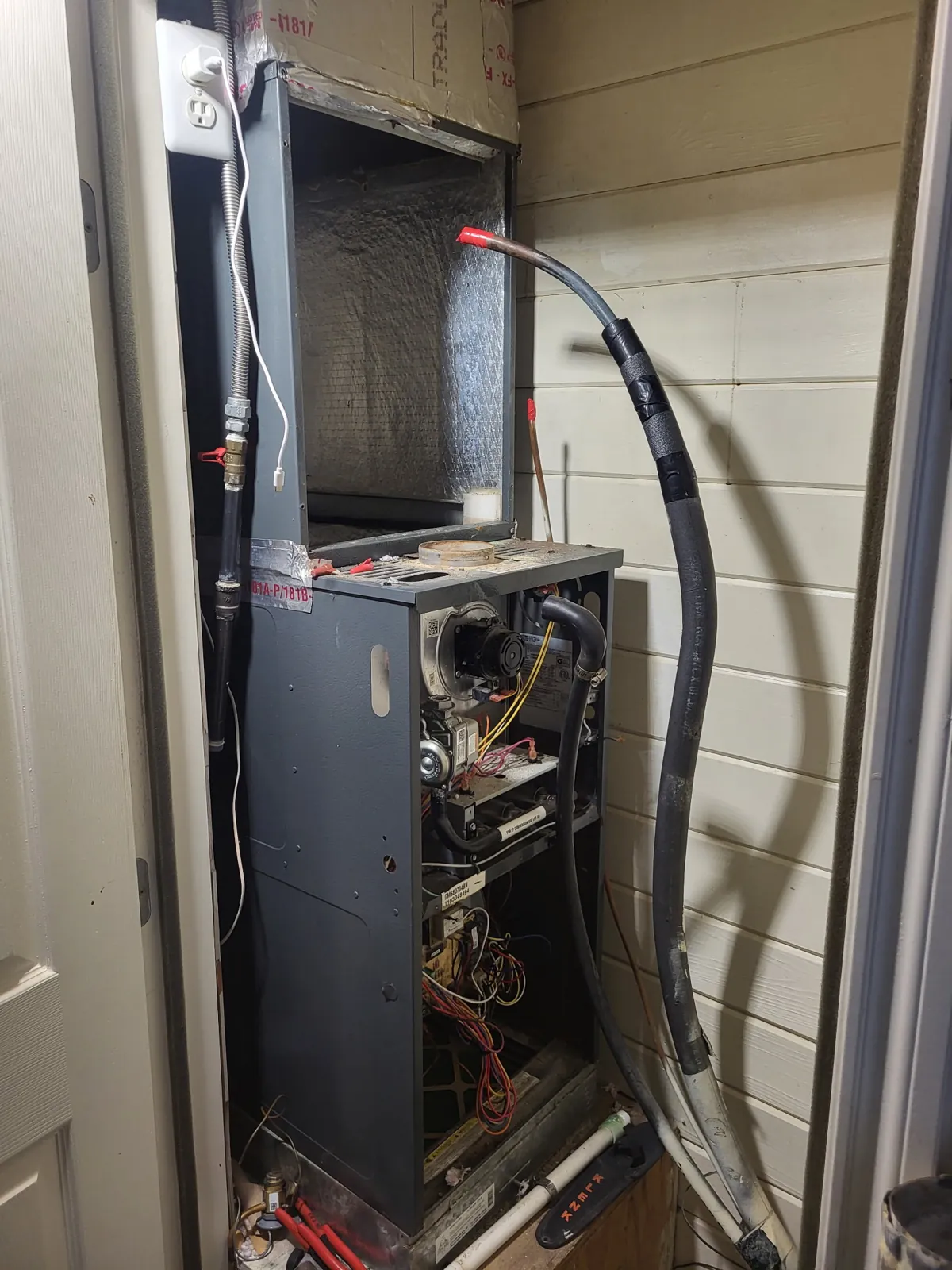 Open furnace cabinet during a diagnostic HVAC inspection